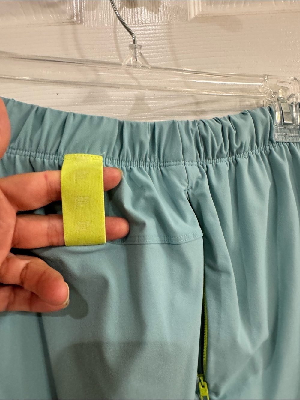Fabletics Light Teal Athletic Shorts with Neon Yellow Accents - Picture 3 of 9